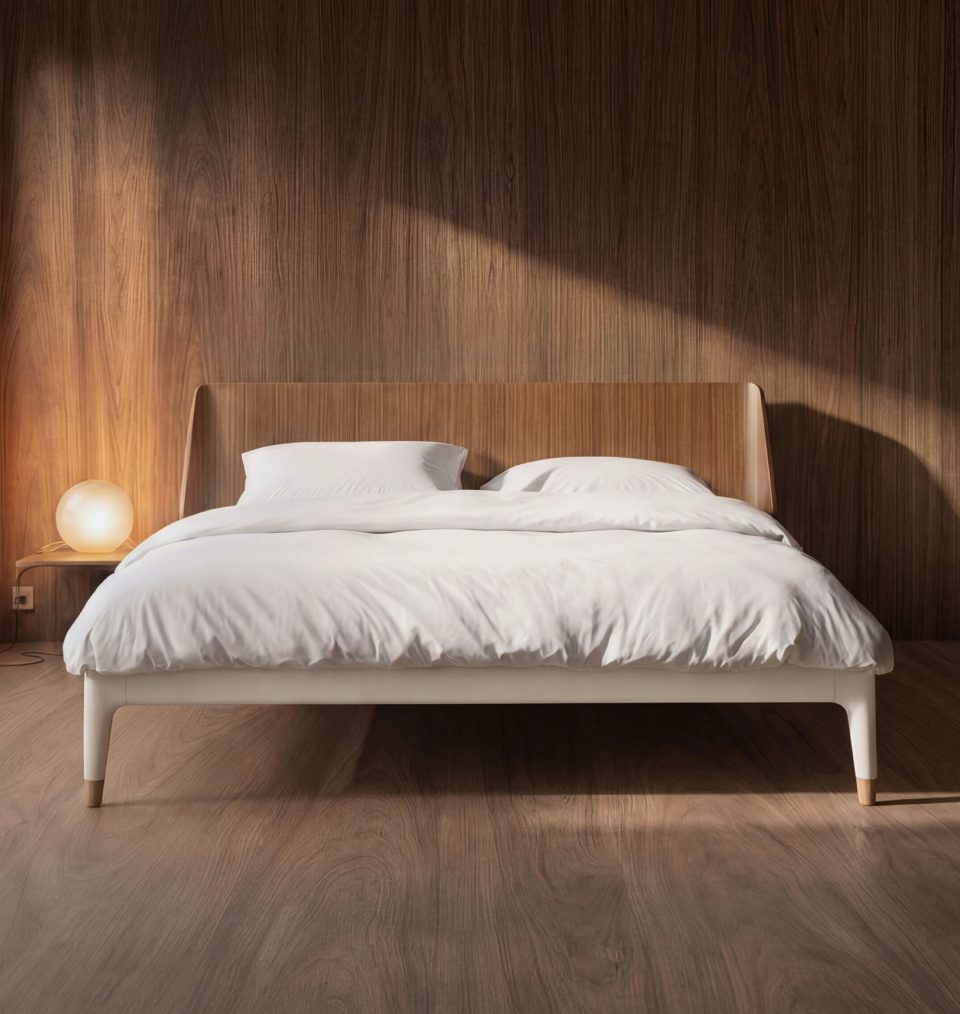 Auping Essential bed in walnut with white bedding, in a wood-panelled bedroom